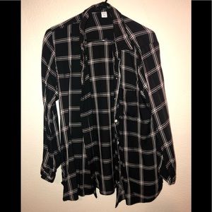 Pink/white/black button up shirt.